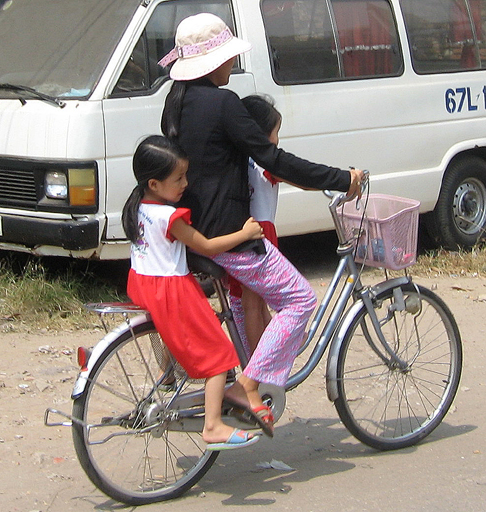 Mother and kids on a bicycle