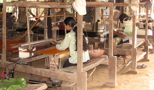 Woman operating a hand loom