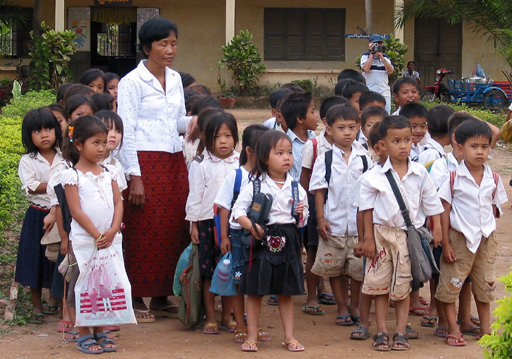 Childern preparing for a flag lowering ceremony at the public school